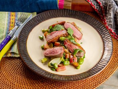 Traci Des Jardins’ Duck Breast with Rhubarb, Spring Onions and Blistered Fava Beans, as seen on Guy's Ranch Kitchen Season 6.