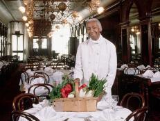 The famous southern chef, Edna Lewis, stands in the dining room of the Gage & Tollner restaurant. (Photo by James Marshall/Corbis via Getty Images)