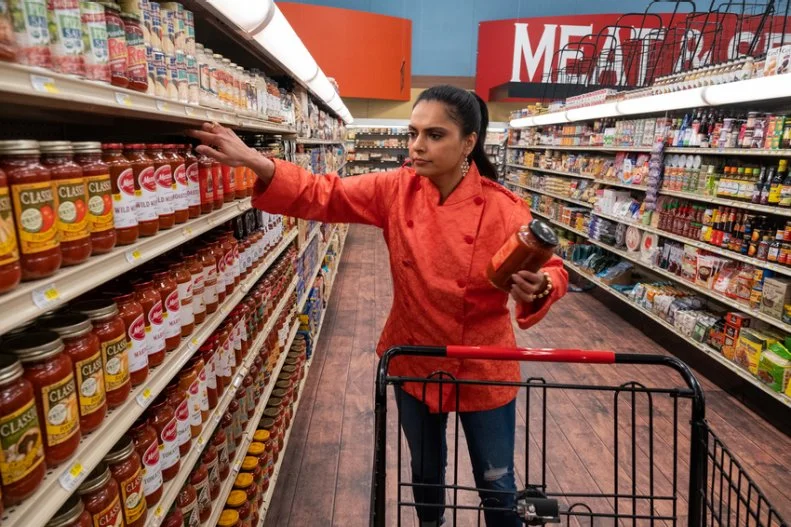 Contestant Maneet Chauhan shops for ingredients, as seen on Guy's Grocery Games, season 24.
