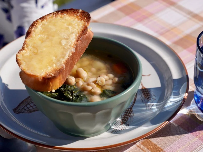 Beauty shot of Molly Yeh's Bean Soup with Challah Crouton, as seen on Girl Meets Farm Season 12.