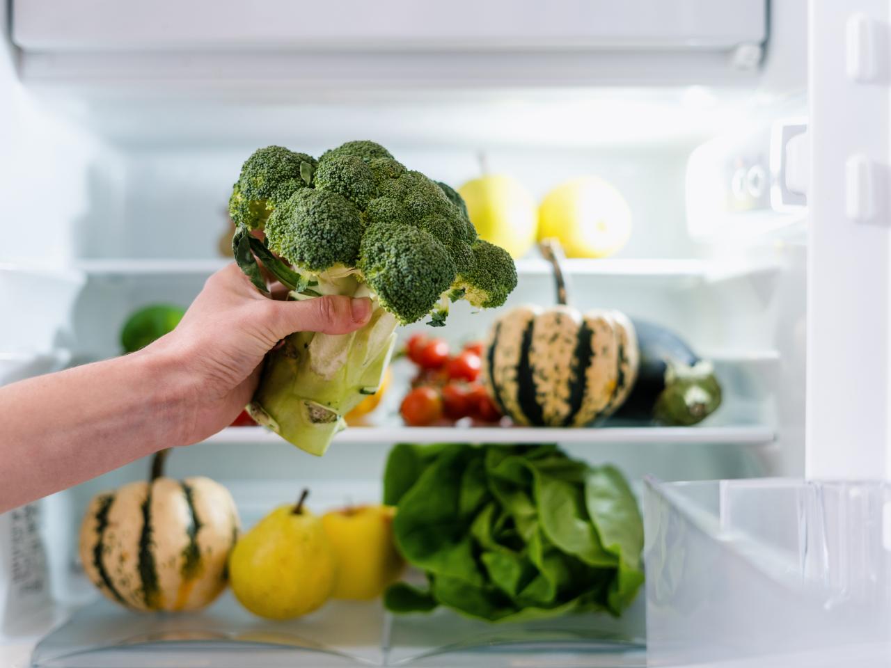 https://food.fnr.sndimg.com/content/dam/images/food/fullset/2023/3/07/fresh-broccoli-being-held-in-front-of-open-refrigerator.jpg.rend.hgtvcom.1280.960.suffix/1678219501117.jpeg