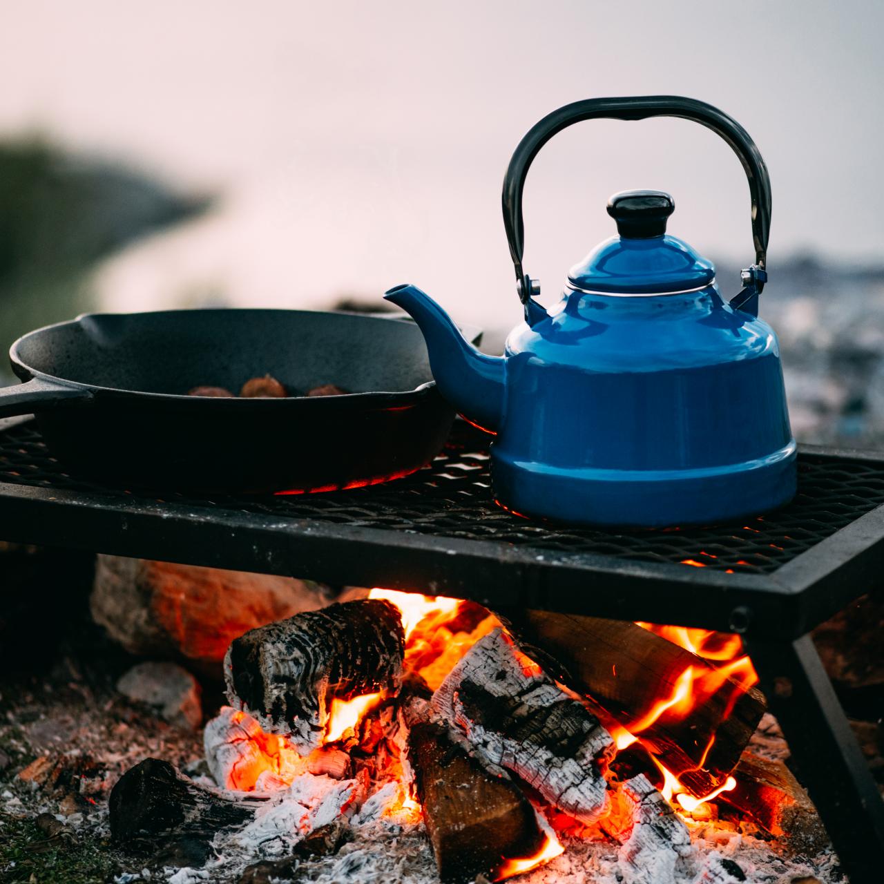 Smoked Tourist Kettle On Camp Fire Stock Photo, Picture and