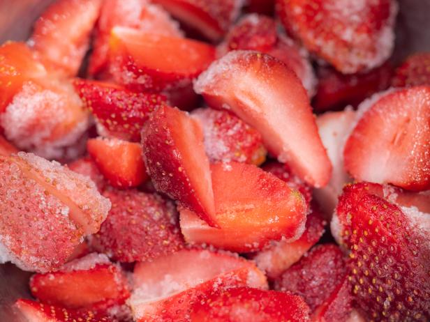 chunks of frozen strawberries for sweet making and cocktails