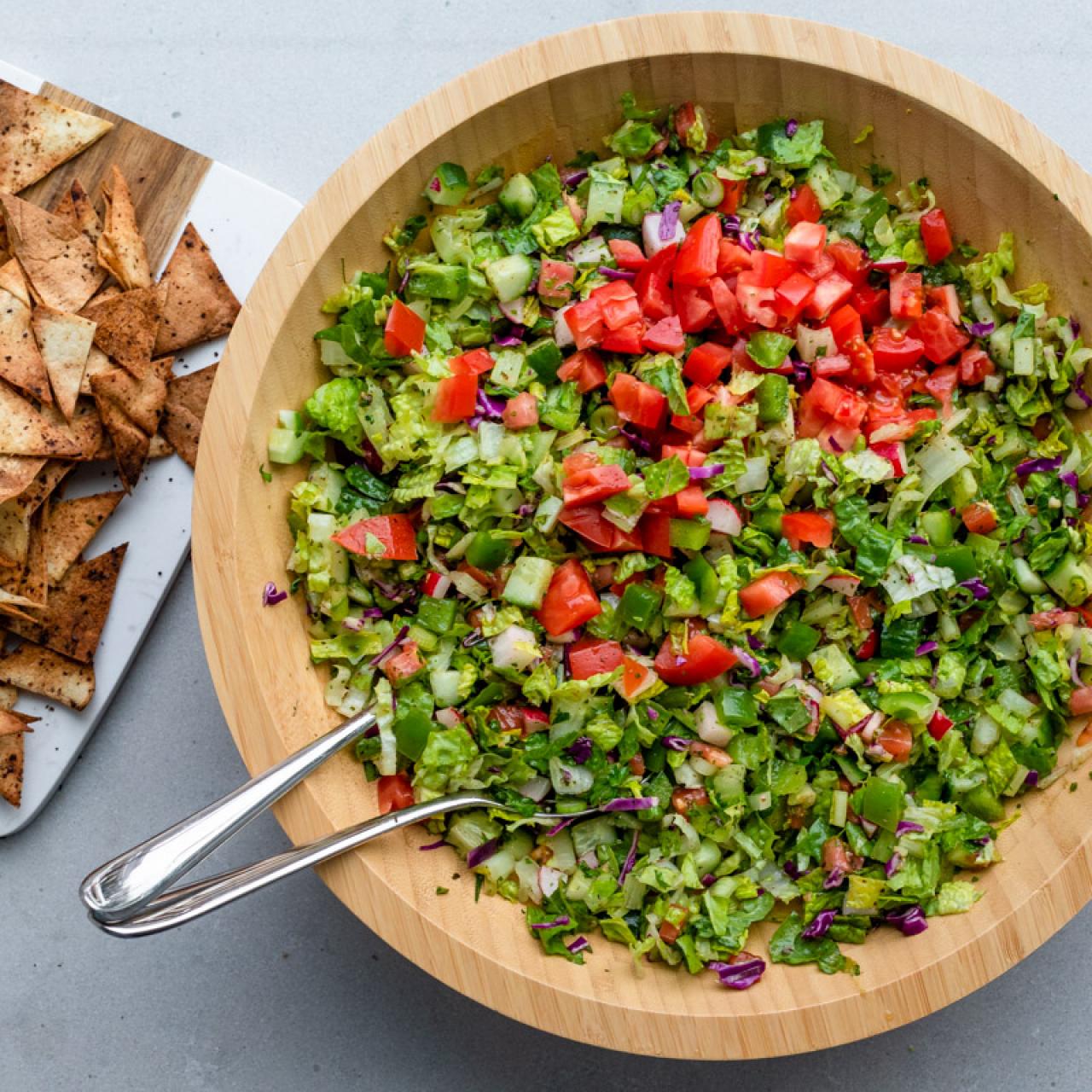 https://food.fnr.sndimg.com/content/dam/images/food/fullset/2023/3/24/Chopped-Fattoush-with-Pita-Chips-4.jpg.rend.hgtvcom.1280.1280.suffix/1679678949220.jpeg