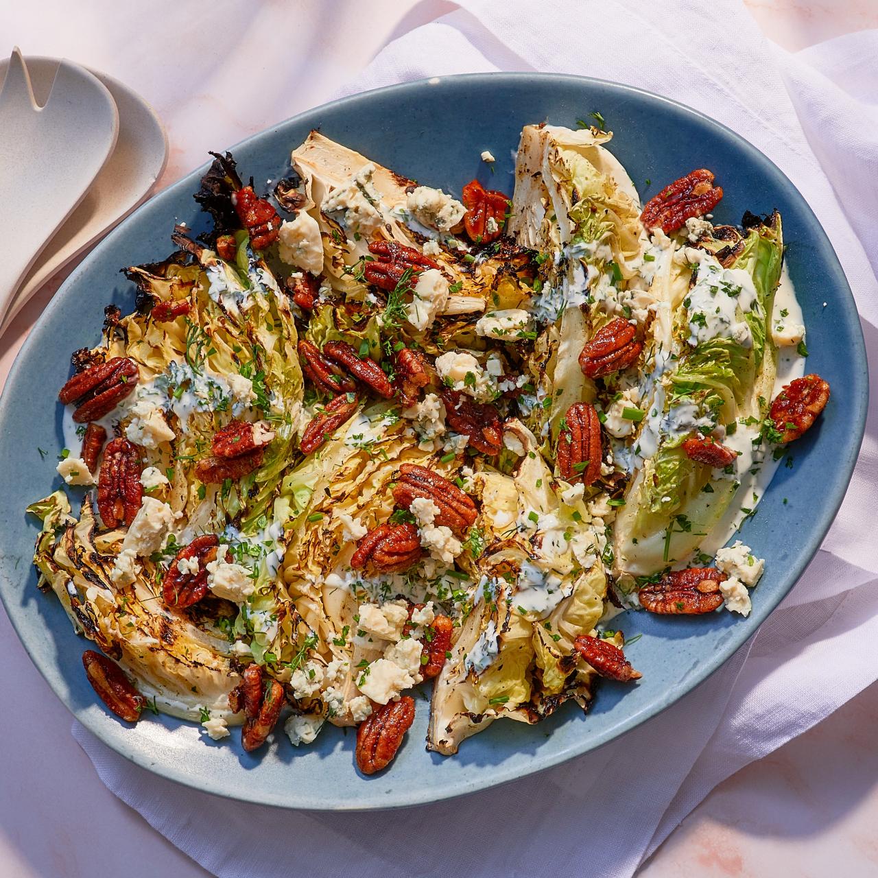 https://food.fnr.sndimg.com/content/dam/images/food/fullset/2023/3/24/FPLF125-mary-berg-charred-cabbage-with-blue-cheese-and-spicy-pecans_s4x3.jpg.rend.hgtvcom.1280.1280.suffix/1679681218199.jpeg