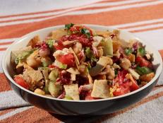 This is kind of like a Greek chopped salad. It has great texture and flavor and you can always use the greens of your choice. Make the dressing ahead of time in a mason jar and make a bunch, if you want, as it will hold in your fridge for weeks. Also, there are so many good store-bought pita chips out there, so there's no reason to make your own.