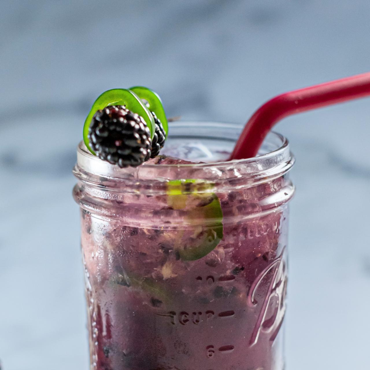 https://food.fnr.sndimg.com/content/dam/images/food/fullset/2023/4/04/WU3401-ree-drummond-jalapeno-blackberry-margarita_s4x3.jpg.rend.hgtvcom.1280.1280.suffix/1680635009337.jpeg