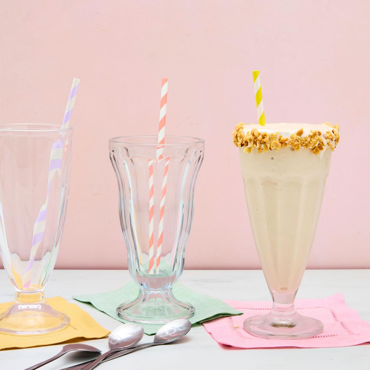 DIY make your own milkshake kit with mini milk bottle, marshmallows,  flavoured milk powders, candy, spoons etc