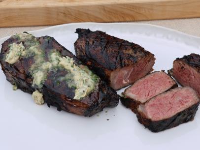 Grilled Strip Steak with Anchovy Garlic Butter, as seen on Symon's Dinners Cooking Out, Season 4.