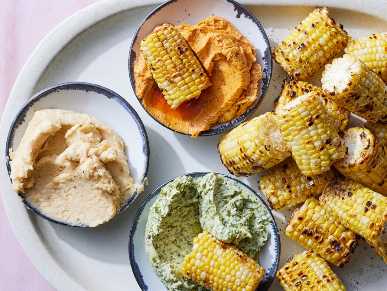 https://food.fnr.sndimg.com/content/dam/images/food/fullset/2023/5/16/fnk_GRILLED_CORN_AND_THREE_FLAVORED_BUTTER_BOARD_s4x3.jpg.rend.hgtvcom.1280.960.suffix/1684262642622.jpeg