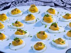 All the men in the Symon family have a true love for deviled eggs and we are always playing with different recipes. But one thing always remains: we aren't shy with the mustard. This variation is topped with pickled mustard seeds, AKA Cleveland caviar, which gives it a great pop and crunch.