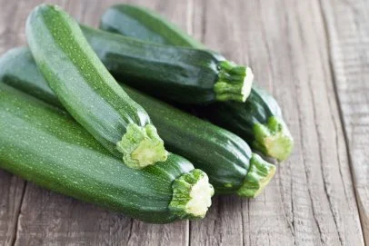 https://food.fnr.sndimg.com/content/dam/images/food/fullset/2023/5/17/zucchini-on-table.jpg.rend.hgtvcom.406.271.85.suffix/1684442422649.webp
