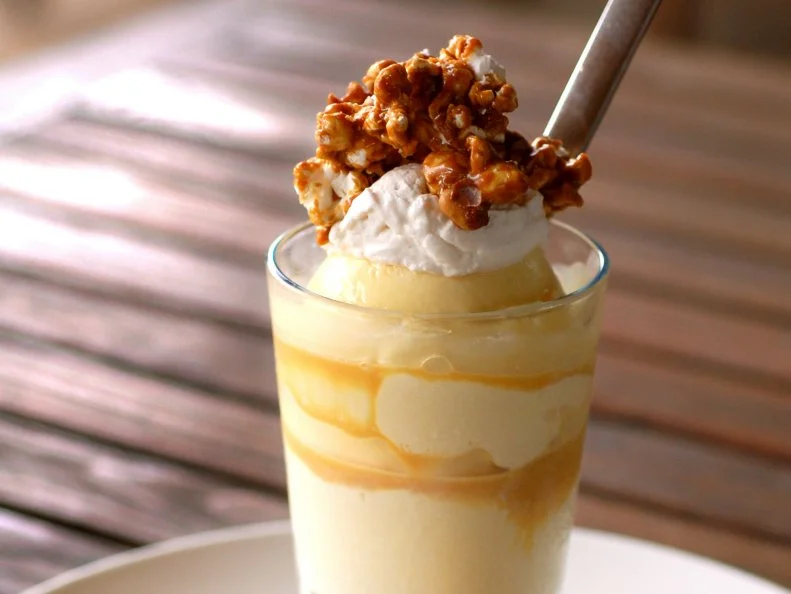 Over-the-Top treat from GEORGIA. Popcorn Ice Cream Sundae. This ode to Cracker Jack at Canoe restaurant in Atlanta has popcorn ice cream, Chantilly cream and popcorn-nut clusters.