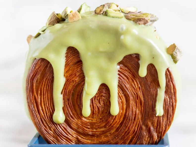 Over-the-Top treat from NEW YORK. Pistachio Suprême. Pistachio flavor is a win at NYC’s Lafayette Grand Café and Bakery\, but specials like Sour Cherry Amaretto take the...croissant.