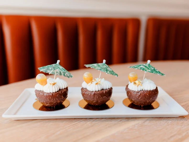 Over-the-Top treat from SOUTH DAKOTA. The Getaway. In Sioux Falls the next best thing to a tropical vacation is chocolatecoated coconut lime cake and crémeux at CH Pâtisserie.