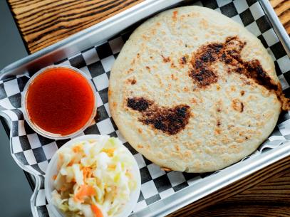 Pupusa with Chicharron, as served by La Pupusa Urban Eatery, located in Los Angeles, CA, as seen on Diners, Drive-Ins and Dives, Season 37.
