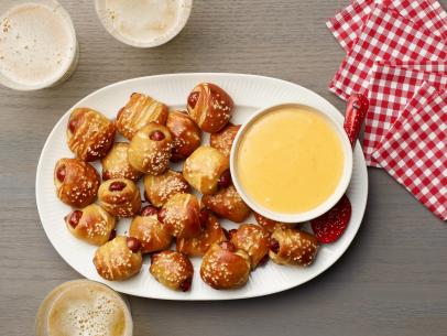 Food Network Kitchen’s Biscuit Pretzel Bites with Hot Dogs and Nacho Cheese Dipping Sauce as seen on Food Network.