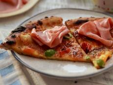 Baloney has always been Molly&rsquo;s favorite lunch meat and it&rsquo;s the perfect salty topping for pizza, similar to mortadella. Slice it thin and yum! That together with garlic white sauce, loads of mozzarella and roasted tomatoes on a chewy thin crust&hellip;there&rsquo;s no phony baloney here!
