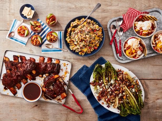 Guy Fieri's Fire-Roasted Shrimp Cocktail; Beef Ribs with Orange BBQ Sauce; Chipotle Corn Salad with Grilled Bacon; Grilled Romaine with Shiitakes and Blue Cheese; Tropical Grilled Banana Splits. Barbecue\, meal on the grill.