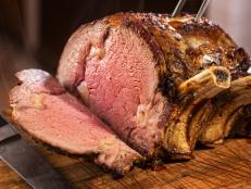 Prime rib roast on cutting board.