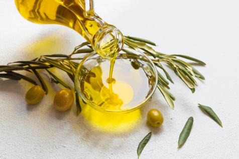 https://food.fnr.sndimg.com/content/dam/images/food/fullset/2023/9/19/olive-oil-pouring-into-bowl-with-olives-on-side-on-white-background.jpg.rend.hgtvcom.476.317.suffix/1695126309040.jpeg