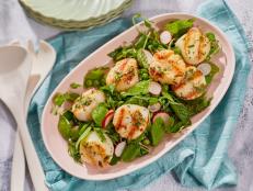 This bright seafood side dish features mint, scallops and peas.