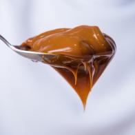 close up of spoon with dulce de leche