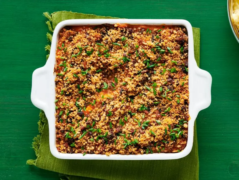 Mashed sweet potato casserole with bacon breadcrumbs; roasted garlic mashed potatoes.