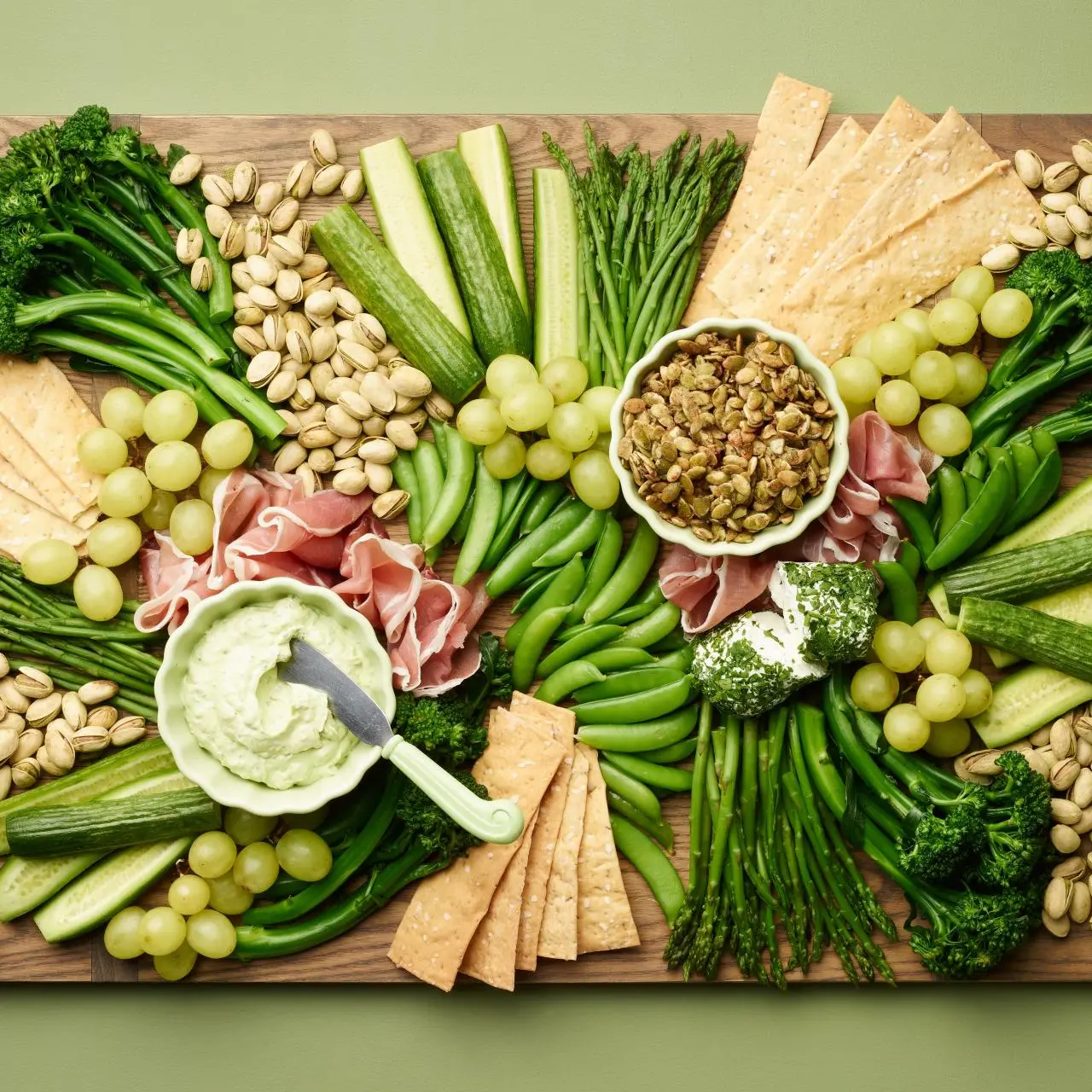 https://food.fnr.sndimg.com/content/dam/images/food/fullset/2024/01/22/FNK_SpringGreenCharcuterieBoard_H.jpg.rend.hgtvcom.1280.1280.suffix/1706030211790.webp