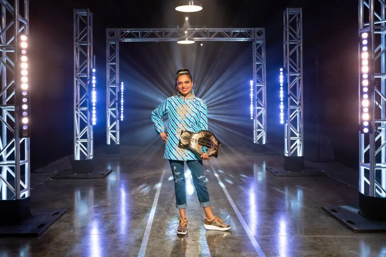 Contestant Maneet Chauhan with her 2021 Tournament of Champions Belt, as seen on Tournament of Champions, Season 5.