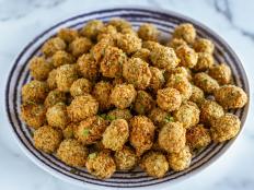 Fried olives make an unexpected and elegant nibble for a party. They are perfect for the holidays but also on a summer evening with a glass of wine. Ree sprinkles hers with parsley, but you could serve with a dipping sauce of marinara or sprinkle over some grated Parmesan.