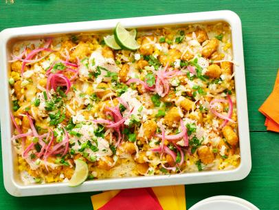 Molly Yeh’s Mexican Street Corn Loaded Tots; Katie Lee Biegel’s Buffalo Chicken Totchos; Guy Fieri’s Parmesan Taters. Over-the-top Tater Tots.