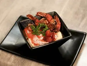 Shrimp and Grits prepped by Chef Andrea Jones at Cork Room in Paducah, Kentucky, as seen on Food Network's Best Bite In Town, Season 1