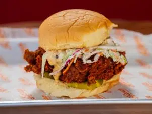 Co-Host Noah Cappe’s THE Sandwich from Haven Hot Chicken, as seen on Best Bite in Town, Season 1.