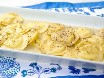 Lemon Ricotta Ravioli with Cacio e Pepe Sauce, as seen on Food Network's Symon's Dinners Cooking Out, Season 5.