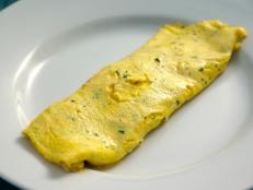 Everyone should know how to make a classic French omelette. It is one of the first things I teach our young cooks because it takes finesse and technique to do consistently great. This slightly nontraditional version is made on the grill, a fun way to cook your eggs and not hard to master, although you can also prepare it on the stovetop.