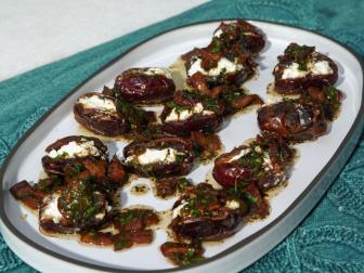 Dates Stuffed with Goat Cheese in Bacon Brown Butter, as seen on Food Network's Symon's Dinners Cooking Out, Season 5.
