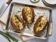 Looking for an indulgent side dish that will stand out next to a steak? You can't go wrong with these Shrimp Scampi-Stuffed Potatoes!