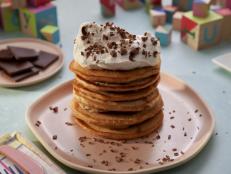 These are a nutty version of the pancakes Molly makes with her family weekly. They&rsquo;re thick and fluffy, and topped with a big dollop of yogurt whipped cream. Bonus: they get Molly &lsquo;cool mom&rsquo; status every time she makes them.