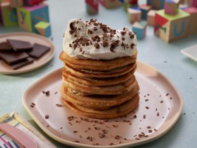 Beauty shot of Molly Yeh's Chocolate Chunk Peanut Butter Pancakes + Whipped Cream, as seen on Girl Meets Farm Season 14