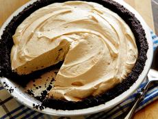 Ree Drummond's Chocolate Peanut Butter Pie recipe from Food Network is a crowd-pleaser for any occasion.