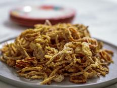 Fried red onions make a great side dish or topping for a burger or meatball sub, especially if you fancy something different from traditional onion rings. The use of Fresno chiles gives a delicious and unexpected spicy kick.