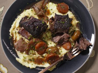 Geoffrey Zakarian's Braised Short Ribs with Smoked Olives Beauty, as seen on The Kitchen, Season 36.