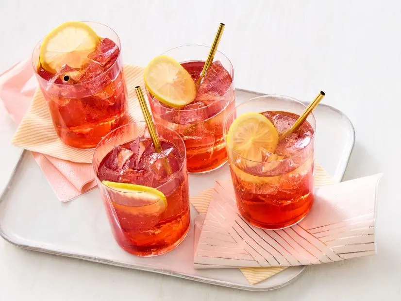Bourbon Hibiscus Iced Tea\, Strawberry-Arugula Salad in Parmesan Cups\, Momma Pat’s Goodie Bars\, and Southern Tea Sandwiches.