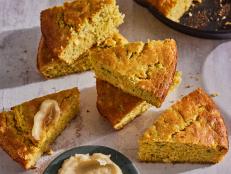 This tender and fluffy cornbread is laced with freshly shredded zucchini, which adds the perfect amount of moisture. There’s also a touch of oniony chives and fresh corn kernels for textural appeal. Serve slices with the homemade honey butter, and you’ll have the perfect summer side dish.