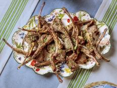Lamb is a traditional dish to serve in the spring. Ree serves her chops with simple classic flavors, such as garlic, lemon and rosemary, and adds red pepper flakes for a hint of spice.