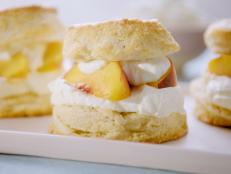 Molly admits that she was a latecomer to the magic of shortcakes, until she started making them from scratch and eating them immediately. This version is like subtly sweet buttery biscuits, stacked high and stuffed with syrupy macerated peaches with dollops of tangy cream cheese whipped cream, for stability and deliciousness!