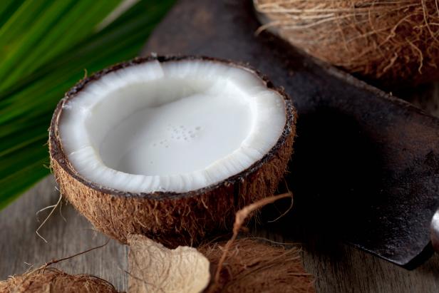 half coconut (Cocos nucifera) with coconut milk