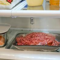 The inside of a refrigerator, with food stored in separate containers for safety.