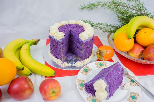Filipino purple yam cake in a display at Xmas with fruit